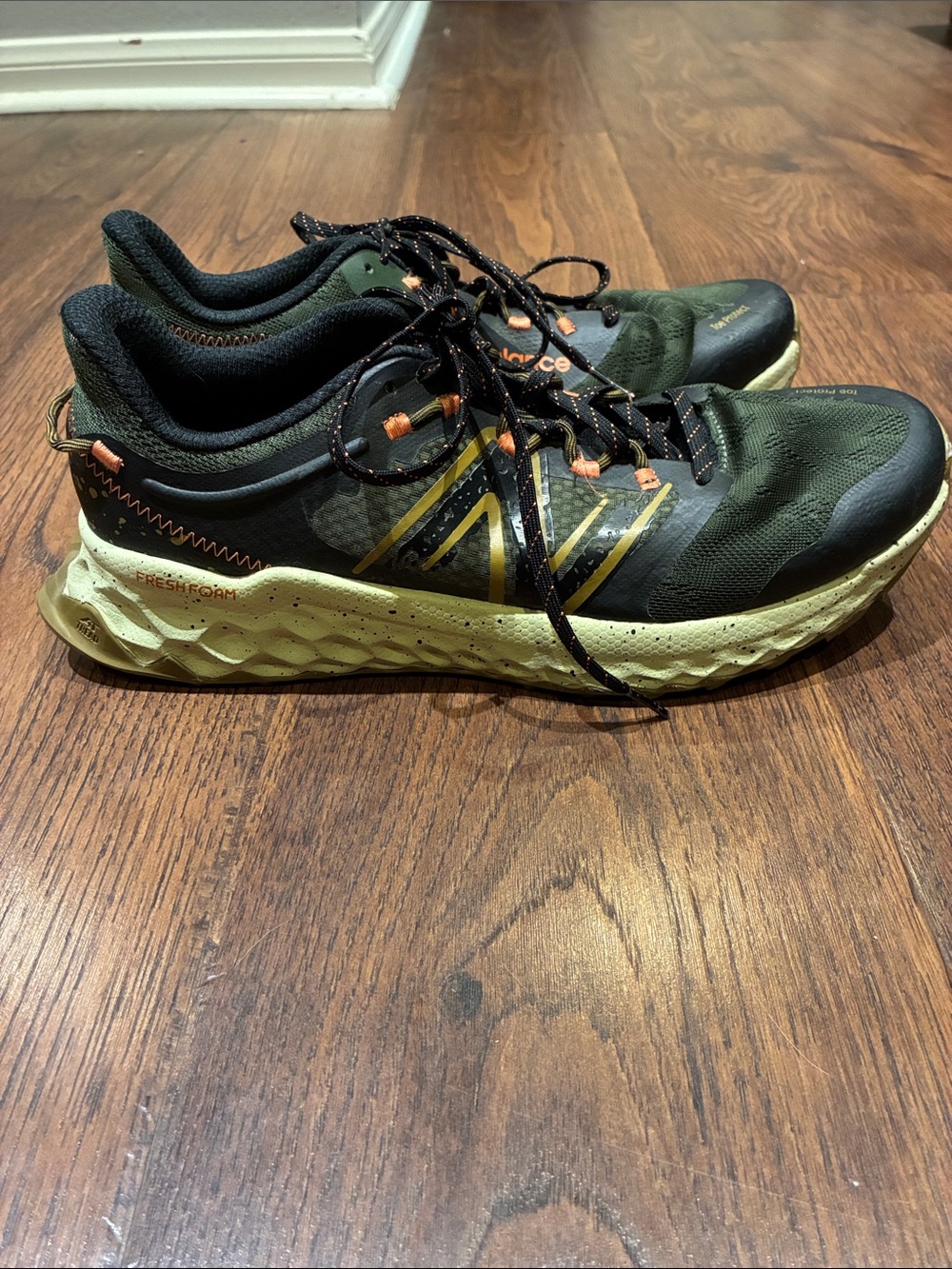 New Balance Olive Green and Black Trail Sneakers with Orange Accents - Picture 2 of 9